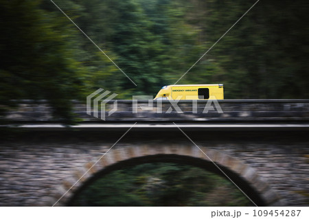 Ambulance car of emergency medical service in blurred motion Ambulance car of emergency medical service in blurred motion 109454287