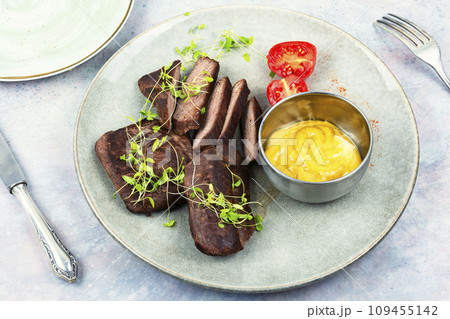 Fried tasty ostrich steaks. 109455142