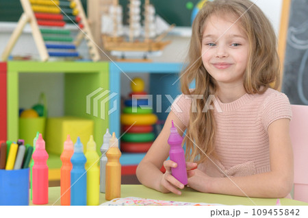 Portrait of cute girl drawing picture at home Portrait of cute girl drawing picture at home 109455842