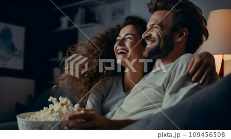 Young happy couple watching movie 109456508