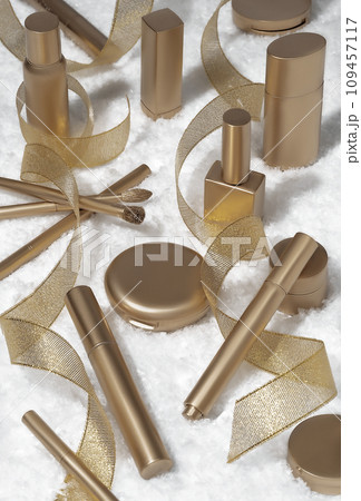 Luxury composition of golden cosmetic products and party streamers on white snow background. Holiday background. Beauty concept. 109457117