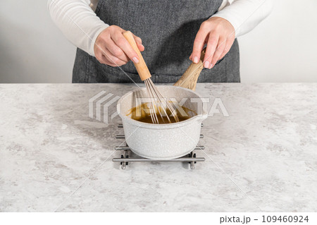 Cooking Swedish meatball sauce in a nonstick cooking pot. Cooking Swedish meatball sauce in a nonstick cooking pot. 109460924