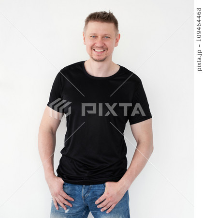 Attractive young man in a black T-shirt. Blank for your design Attractive young man in a black T-shirt. Blank for your design 109464468