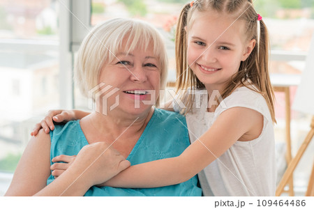 little granddaughter Portrait of happy grandmother hugging with...の写真素材 [109464486] - PIXTA