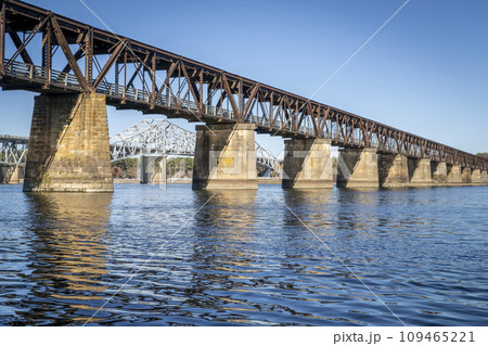 old railroad bridge converted to a footpath - Tennessee River in Florence, Alabama, fall scenery old railroad bridge converted to a footpath - Tennessee River in Florence, Alabama, fall scenery 109465221