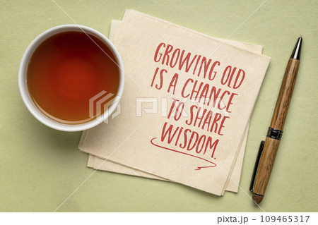 Growing old is a chance to share wisdom - inspirational note on a napkin, aging and personal development concept Growing old is a chance to share wisdom - inspirational note on a napkin, aging and personal development concept 109465317