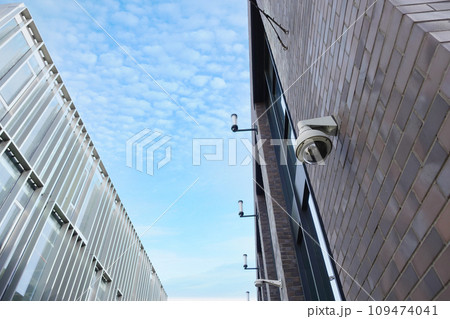 CCTV security camera operating on modern buildings  109474041