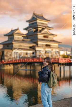 Woman tourist Visiting in Matsumoto, happy Traveler sightseeing Matsumoto Castle or Crow castle. Landmark and popular for tourists attraction in Matsumoto, Nagano, Japan. Travel and Vacation concept Woman tourist Visiting in Matsumoto, happy Traveler sightseeing Matsumoto Castle or Crow castle. Landmark and popular for tourists attraction in Matsumoto, Nagano, Japan. Travel and Vacation concept 109474916