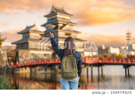 Woman tourist Visiting in Matsumoto, happy Traveler sightseeing Matsumoto Castle or Crow castle. Landmark and popular for tourists attraction in Matsumoto, Nagano, Japan. Travel and Vacation concept Woman tourist Visiting in Matsumoto, happy Traveler sightseeing Matsumoto Castle or Crow castle. Landmark and popular for tourists attraction in Matsumoto, Nagano, Japan. Travel and Vacation concept 109474920