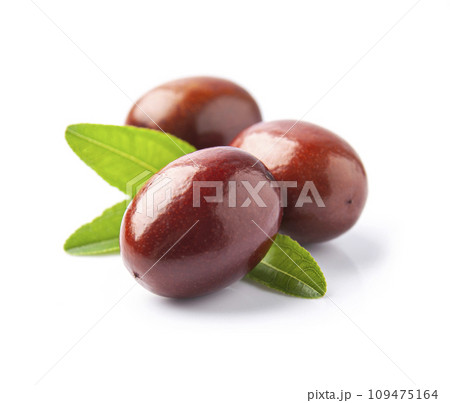 Dates with leaves on white Dates with leaves on white 109475164