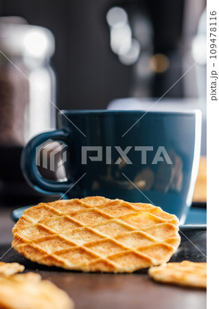 Round waffle biscuits on kitchen table. Round waffle biscuits on kitchen table. 109478116