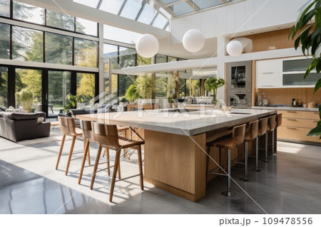 Beautiful kitchen in luxury modern contemporary home interior with island and chairs Beautiful kitchen in luxury modern contemporary home interior with island and chairs 109478556