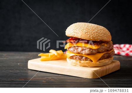 pork burger with cheese, bacon and french fries 109478831