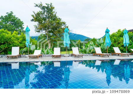 pool bed around swimming pool with mountain hill background 109478869