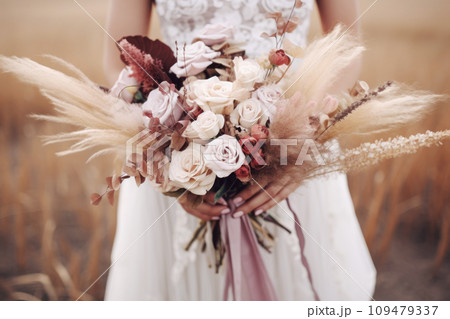 The bride holds a wedding bouquet 109479337
