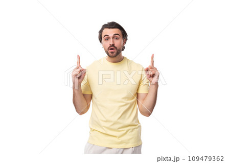young inspired man with a black beard and mustache dressed in a t-shirt young inspired man with a black beard and mustache dressed in a t-shirt 109479362