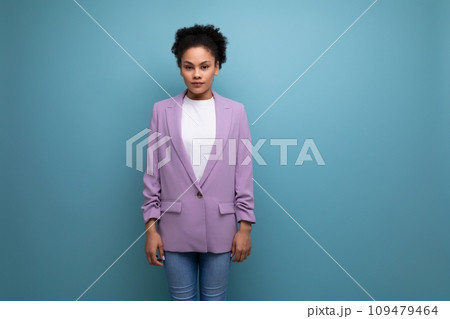 young pretty latin woman dressed in lilac jacket isolated studio background with copy space 109479464