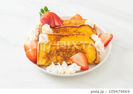 french toast with fresh strawberry and whipping cream 109479669