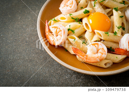 penne pasta white cream sauce with shrimps and egg 109479738