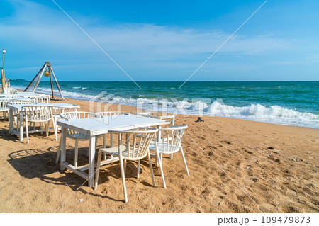 dinning table and chair on beach with sea background 109479873