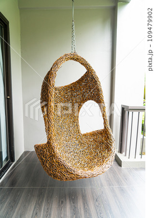 empty wicker swing on blacony 109479902