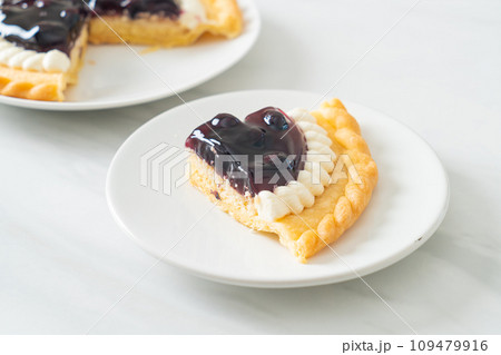 Blueberry Cheese Pie on white plate Blueberry Cheese Pie on white plate 109479916