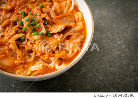 Korean udon ramen noodles with pork in kimchi soup Korean udon ramen noodles with pork in kimchi soup 109480596