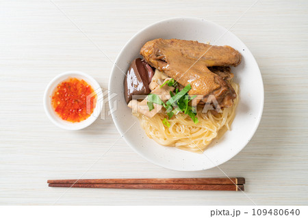 dried noodles with braised duck in white bowl dried noodles with braised duck in white bowl 109480640