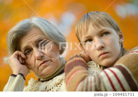 Sad Grandmother with boy in the park Sad Grandmother with boy in the park 109481731
