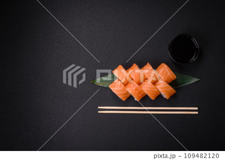 Delicious Philadelphia sushi roll with salmon, shrimp, cucumber and cream cheese Delicious Philadelphia sushi roll with salmon, shrimp, cucumber and cream cheese 109482120
