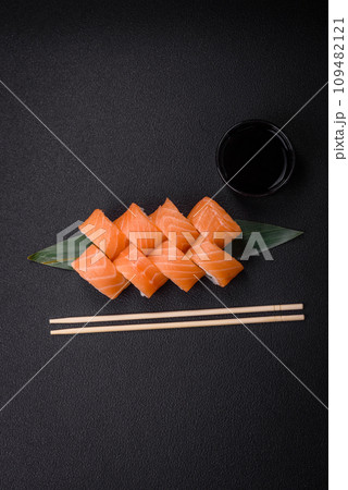 Delicious Philadelphia sushi roll with salmon, shrimp, cucumber and cream cheese Delicious Philadelphia sushi roll with salmon, shrimp, cucumber and cream cheese 109482121