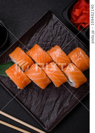 Delicious Philadelphia sushi roll with salmon, shrimp, cucumber and cream cheese 109482140