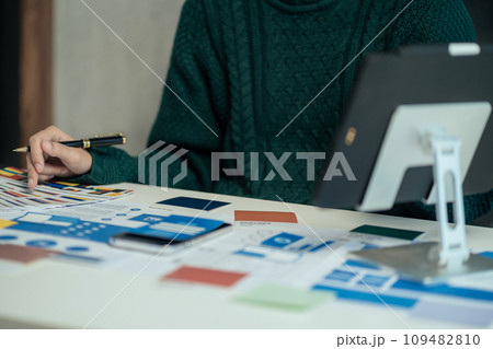 Creative male web designer planning application development for web mobile phone at modern workplace. Creative male web designer planning application development for web mobile phone at modern workplace. 109482810