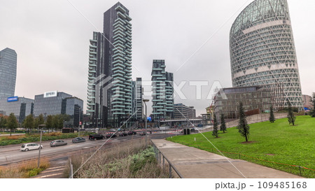 Panorama showing skyscrapers and biblioteca from park with green lawn timelapse in Milan 109485168