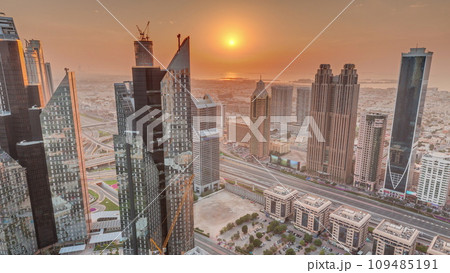 High-rise buildings on Sheikh Zayed Road in Dubai aerial timelapse during sunset, UAE. 109485191