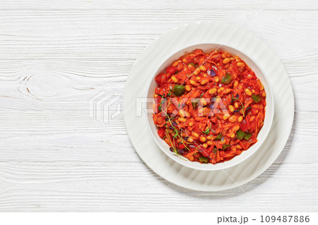chakalaka, spicy tomato bean relish in white bowl 109487886