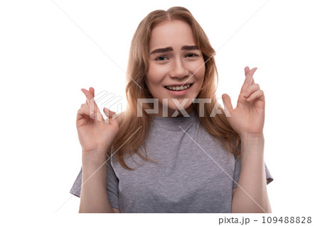 Teenage girl with blond hair doubts on a white background Teenage girl with blond hair doubts on a white background 109488828
