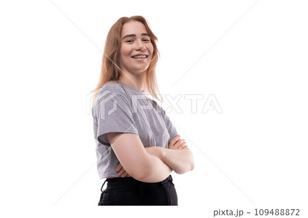 Cute teenage girl with blond hair on a white background 109488872