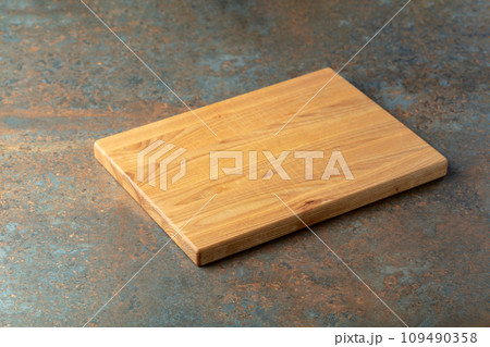 Cutting board on a rusty iron table. Cutting board on a rusty iron table. 109490358
