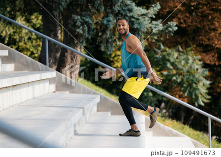 Dark-skinned sportsman running on the stairs during workout 109491673