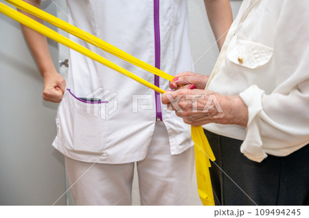 Seniors patients doing exercises in a retirement home. 109494245