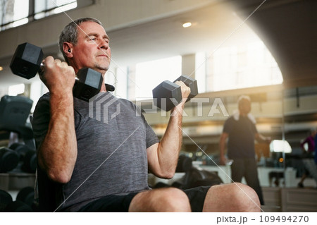 Fitness, gym and senior man with dumbbells for weightlifting, challenge or cardio workout, training or bodybuilding. Biceps, arms and elderly person with hand weight for strength, mindset or exercise Fitness, gym and senior man with dumbbells for weightlifting, challenge or cardio workout, training or bodybuilding. Biceps, arms and elderly person with hand weight for strength, mindset or exercise 109494270
