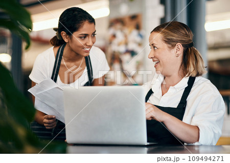 Small business owner working on a budget strategy or ordering stock online with an employee using a laptop in her store. Female entrepreneur talking to a worker about startup growth and sales Small business owner working on a budget strategy or ordering stock online with an employee using a laptop in her store. Female entrepreneur talking to a worker about startup growth and sales 109494271