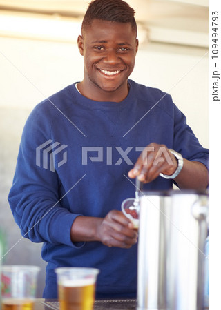 Portrait, party and a black man bartender serving drinks outdoor at an event, festival or celebration. Smile, beer and carnival with a happy young person at a bar in a tent for beverage service 109494793
