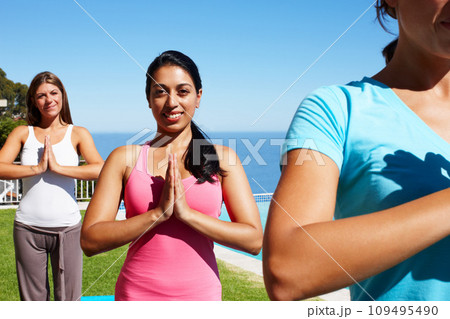 Namaste, yoga and portrait of women on grass together for fitness, exercise or mindfulness resort. Nature, pilates and happy friends at outdoor holistic health retreat for wellness, balance and zen. Namaste, yoga and portrait of women on grass together for fitness, exercise or mindfulness resort. Nature, pilates and happy friends at outdoor holistic health retreat for wellness, balance and zen. 109495490
