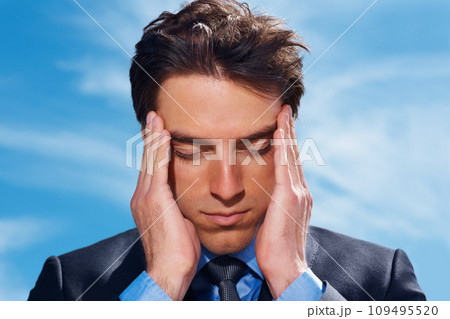 Businessman, headache and stress or burnout, mental health and frustrated by debt and audit. Professional, male person and migraine or fatigue, anxiety and massage temple or brain fog and blue sky 109495520