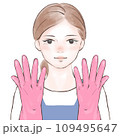 ピンクのゴム手袋を着用するエプロン姿の女性 109495647