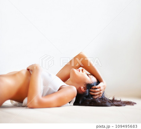 Sexy woman in underwear, relax on floor with - Stock Photo