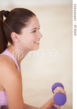 Woman, smile and dumbbell for exercise fitness routine, active performance for strength practice. Female person, weightlifting for health wellness challenge or muscle progress, strong for training 109495802