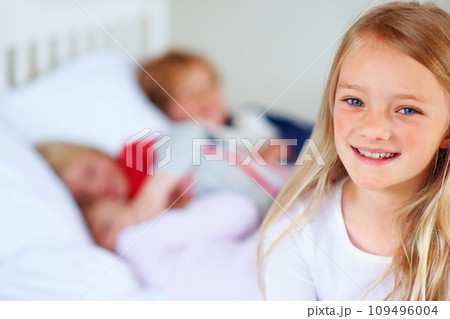 Child portrait, smile and family on bed with love together, hug and bonding with relax wellness in home. Girl, face and happiness in morning for support, care and peace with positive kid in apartment Child portrait, smile and family on bed with love together, hug and bonding with relax wellness in home. Girl, face and happiness in morning for support, care and peace with positive kid in apartment 109496004